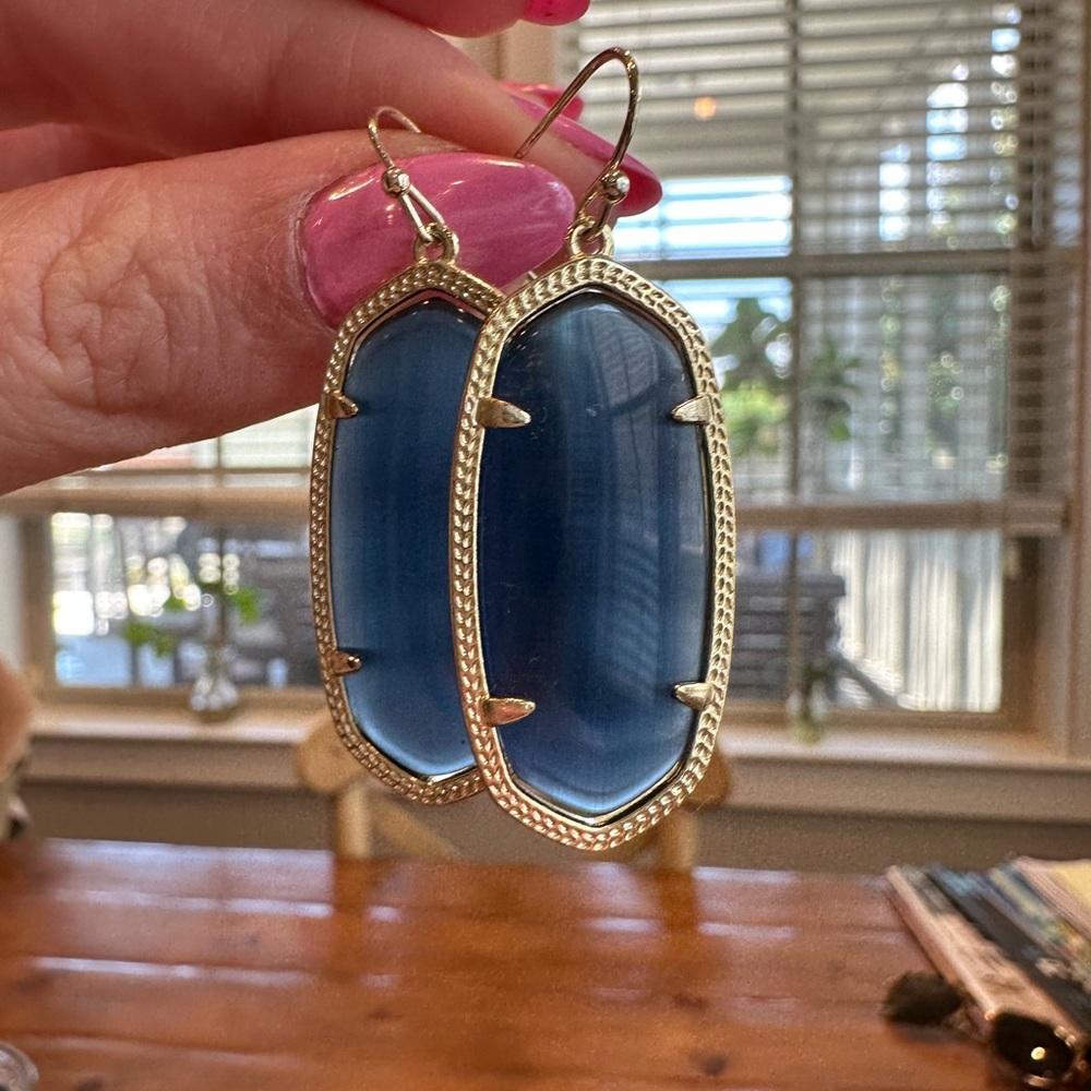 Kendra Scott navy cobalt cats eye Dani earrings with gold hardware.
